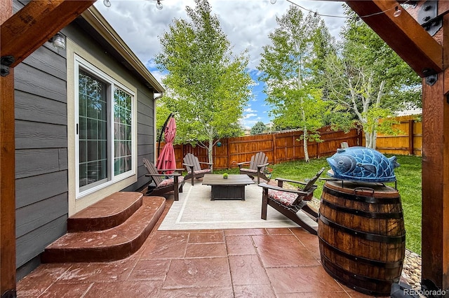 13642 Wrangler Way, Mead, CO 80542 - fenced backyard with a patio and an outdoor hangout area