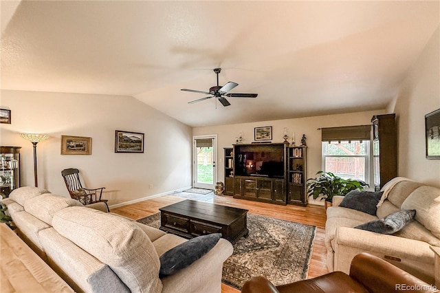 13642 Wrangler Way, Mead, CO 80542 - living room featuring lofted ceiling, light wood-style floors, healthy amount of natural light, and ceiling fan