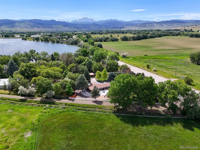 aerial view featuring a rural view and a water and mountain view