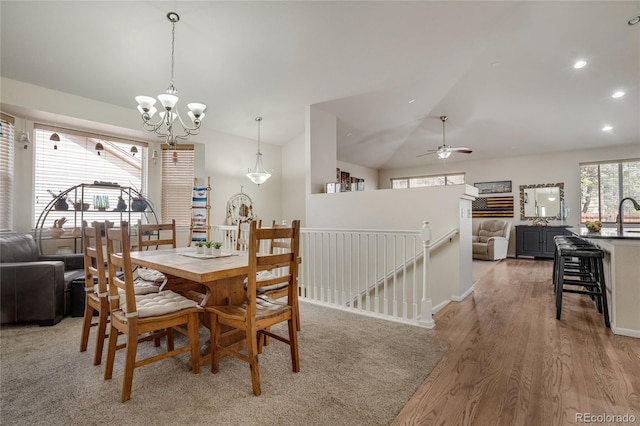 7823 E 130th Pl, Thornton, CO 80602 - dining space featuring a chandelier, vaulted ceiling, light wood-type flooring, recessed lighting, and a ceiling fan