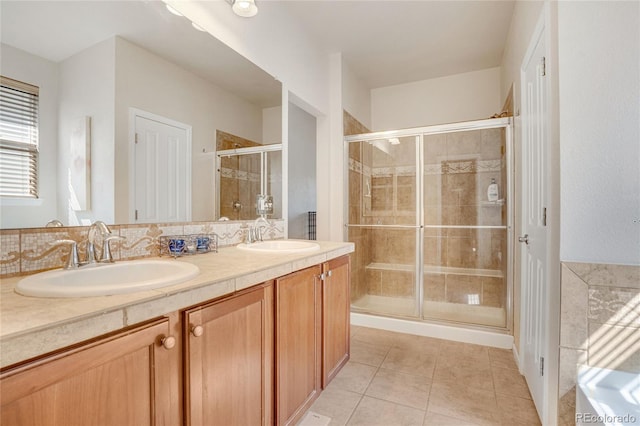 7823 E 130th Pl, Thornton, CO 80602 - bathroom featuring a stall shower, double vanity, and tile patterned floors
