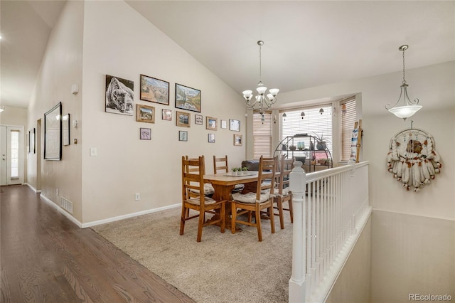7823 E 130th Pl, Thornton, CO 80602 - dining room featuring vaulted ceiling, a chandelier, plenty of natural light, wood finished floors, and baseboards
