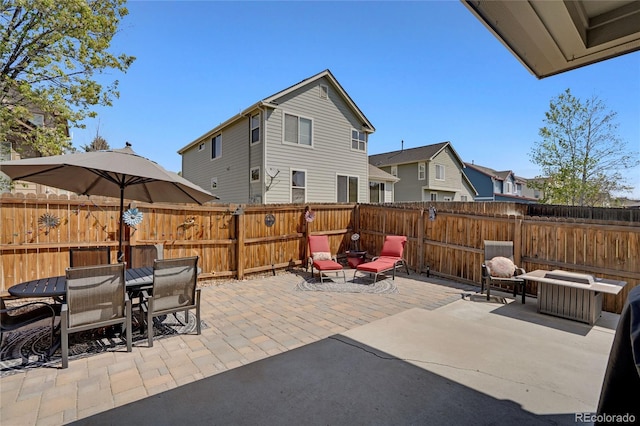7823 E 130th Pl, Thornton, CO 80602 - fenced backyard with a patio, a residential view, and outdoor dining space