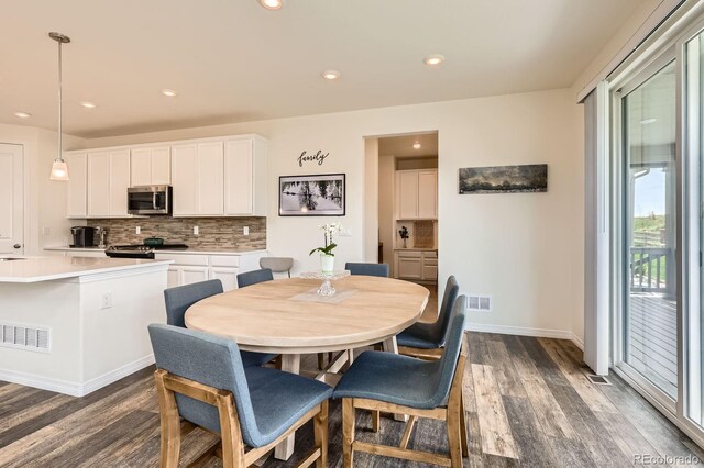 3162 Grizzly Peak Dr, Broomfield, CO 80023 - dining room with dark wood-type flooring, baseboards, and recessed lighting