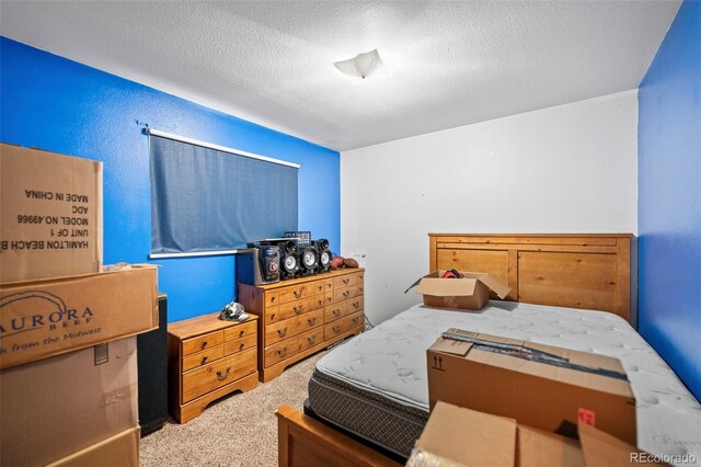 3010 Fireweed Dr, Colorado Springs, CO 80918 - carpeted bedroom with a textured ceiling