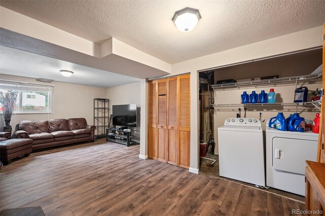 3010 Fireweed Dr, Colorado Springs, CO 80918 - washroom featuring independent washer and dryer, dark wood-style flooring, and a textured ceiling