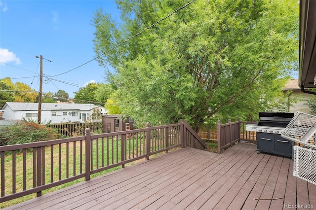 3010 Fireweed Dr, Colorado Springs, CO 80918 - wooden deck featuring a fenced backyard and a grill
