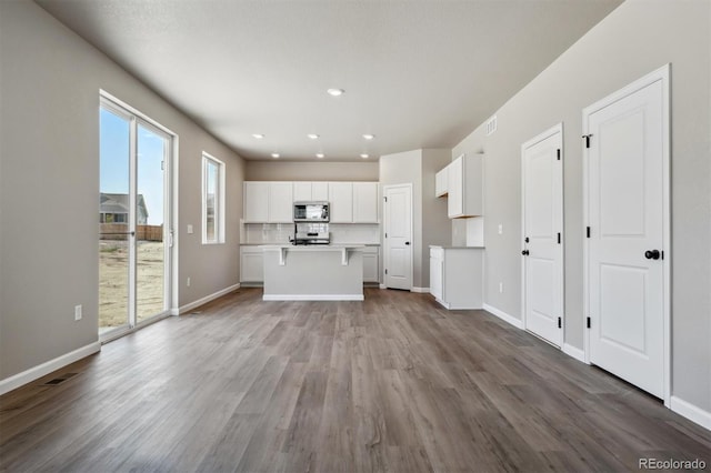 unfurnished living room with light hardwood / wood-style floors