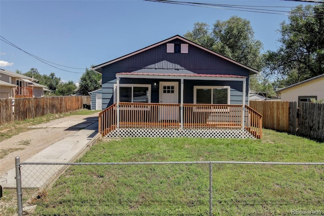 bungalow-style house featuring a front yard and a porch