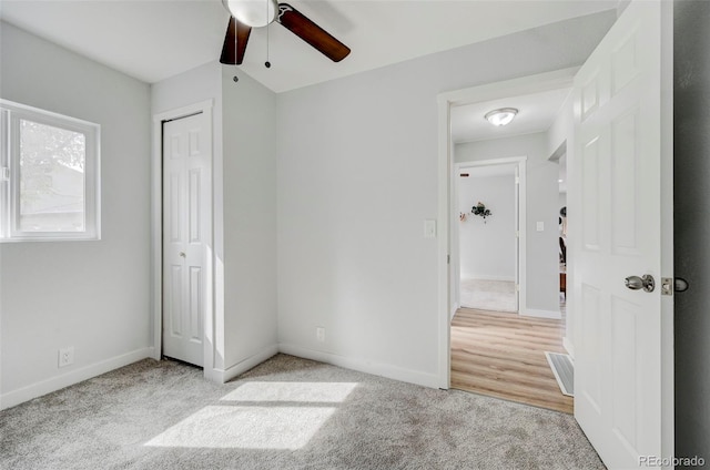 unfurnished bedroom featuring ceiling fan and light hardwood / wood-style floors