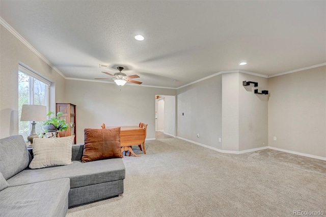 living area with ornamental molding, ceiling fan, light colored carpet, baseboards, and recessed lighting