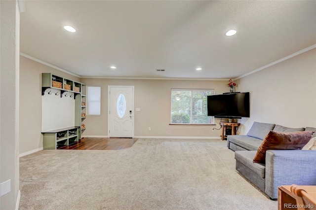 living area with carpet, crown molding, baseboards, and recessed lighting