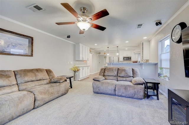 living area featuring ceiling fan, light colored carpet, baseboards, crown molding, and recessed lighting