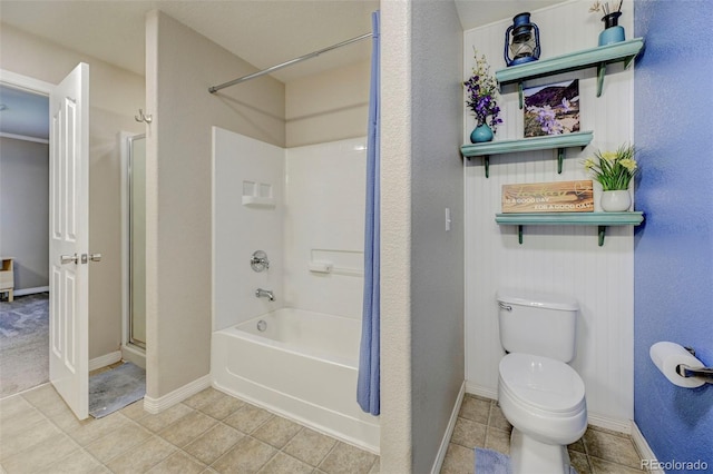 bathroom with baseboards, toilet, tile patterned floors, and shower / tub combination
