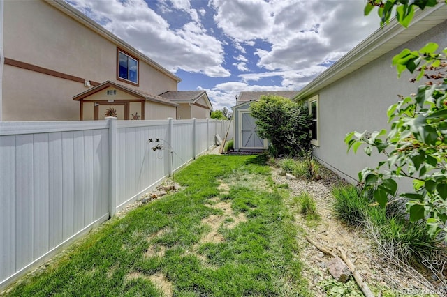 view of yard featuring a shed and an outdoor structure