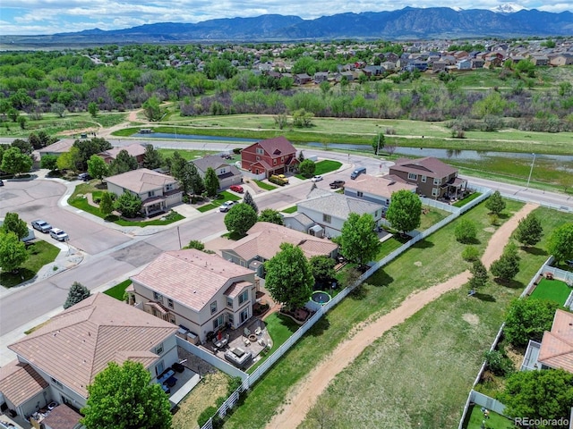aerial perspective of suburban area with a water and mountain view