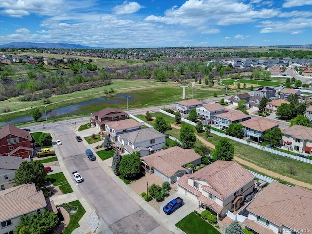 aerial view of residential area with a nearby body of water