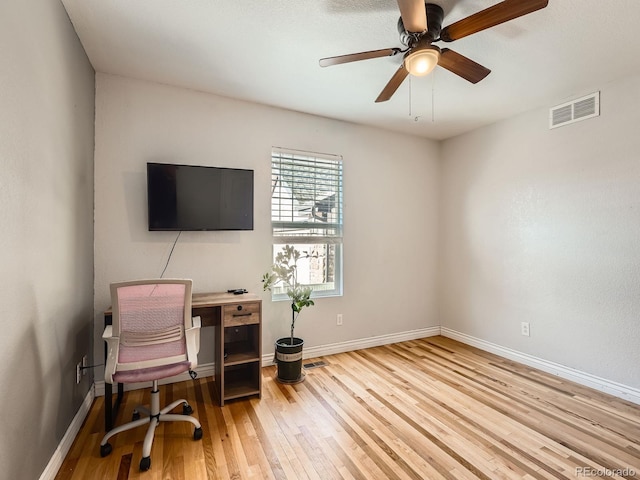 home office featuring ceiling fan and light wood-type flooring