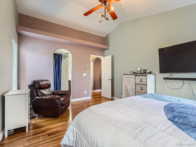 bedroom with hardwood / wood-style floors, ceiling fan, and lofted ceiling