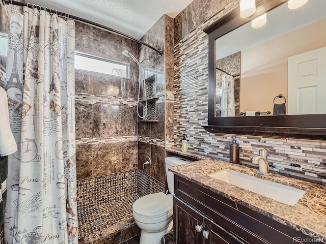 bathroom featuring backsplash, vanity, a shower with shower curtain, and toilet