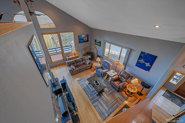 11222 Conifer Mountain Rd, Conifer, CO 80433 - living room with wood finished floors, high vaulted ceiling, recessed lighting, and ceiling fan