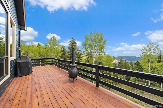 11222 Conifer Mountain Rd, Conifer, CO 80433 - wooden terrace with area for grilling and a mountain view