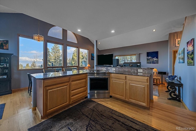 11222 Conifer Mountain Rd, Conifer, CO 80433 - kitchen featuring electric stove, light wood finished floors, open floor plan, recessed lighting, and vaulted ceiling