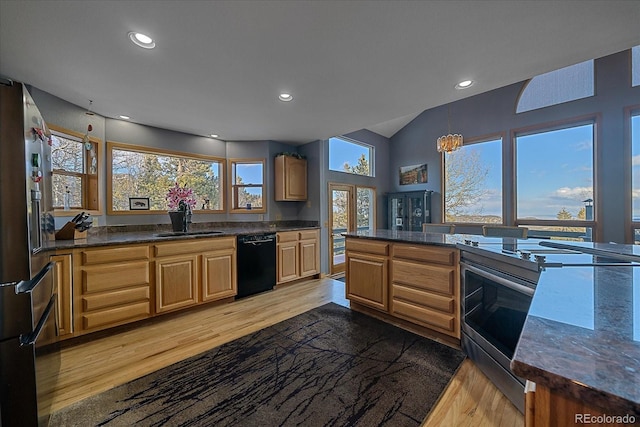 11222 Conifer Mountain Rd, Conifer, CO 80433 - kitchen featuring appliances with stainless steel finishes, light wood-style flooring, recessed lighting, vaulted ceiling, and a chandelier