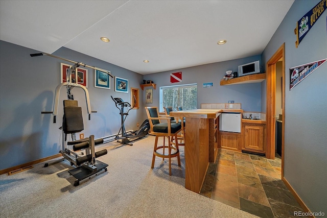 11222 Conifer Mountain Rd, Conifer, CO 80433 - indoor dry bar featuring stone finish floors, dishwasher, and recessed lighting