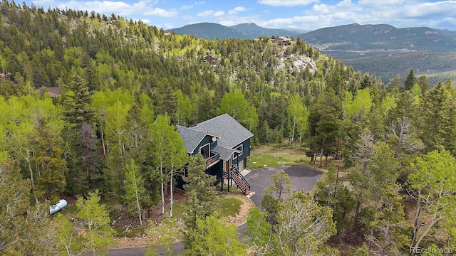 11222 Conifer Mountain Rd, Conifer, CO 80433 - aerial view of a forest and mountains