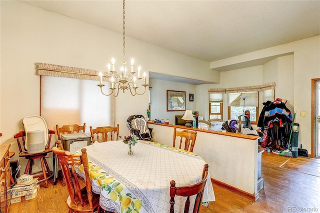 5185 E Weaver Dr, Centennial, CO 80121 - dining space with a chandelier and light wood-style floors