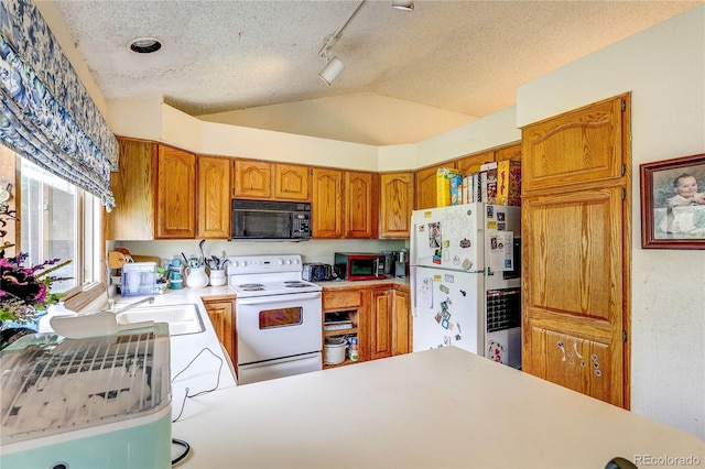 5185 E Weaver Dr, Centennial, CO 80121 - kitchen with white appliances, a textured ceiling, lofted ceiling, light countertops, and brown cabinetry