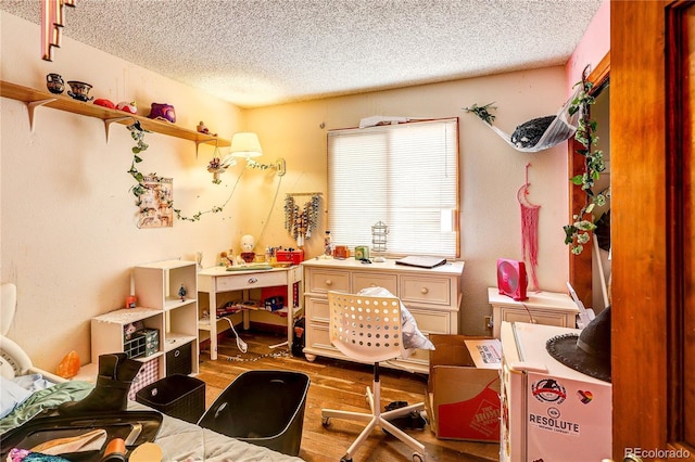 5185 E Weaver Dr, Centennial, CO 80121 - bedroom featuring wood finished floors and a textured ceiling