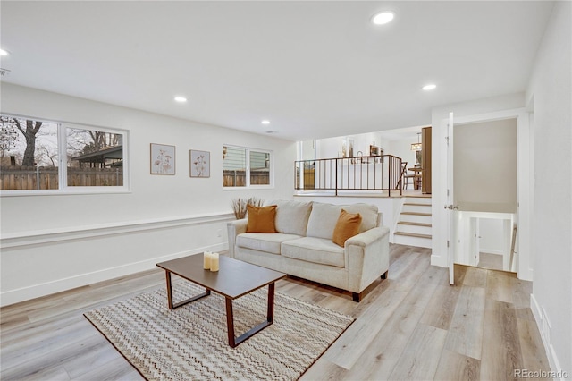 living room with light hardwood / wood-style flooring