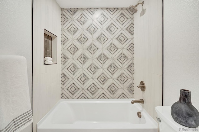 bathroom featuring toilet and bathing tub / shower combination