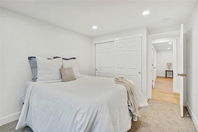 bedroom with carpet flooring and a closet