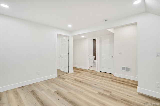 spare room featuring light hardwood / wood-style floors