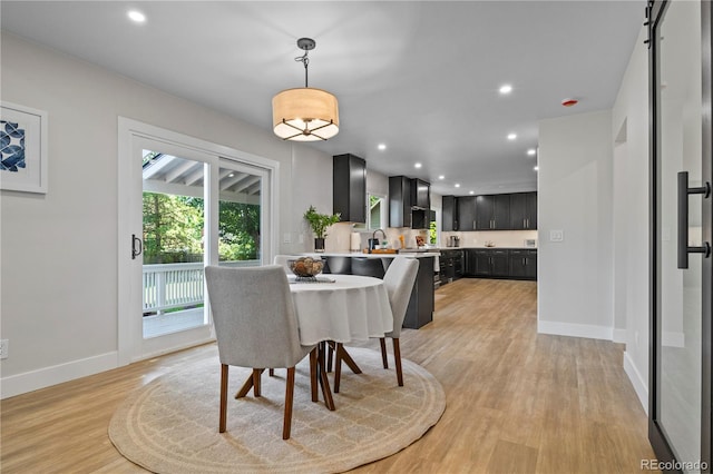 34 Honey Locust, Littleton, CO 80127 - dining area with light wood-style flooring and recessed lighting