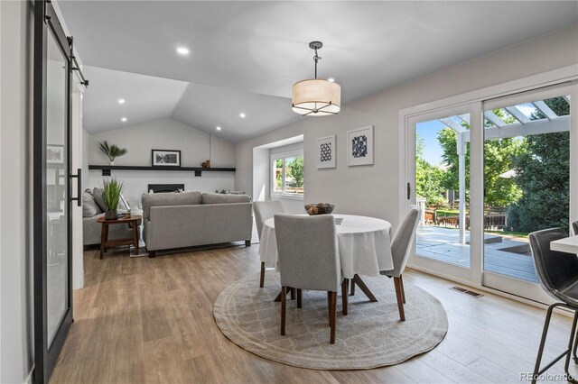 34 Honey Locust, Littleton, CO 80127 - dining space with light wood-style flooring, lofted ceiling, and recessed lighting