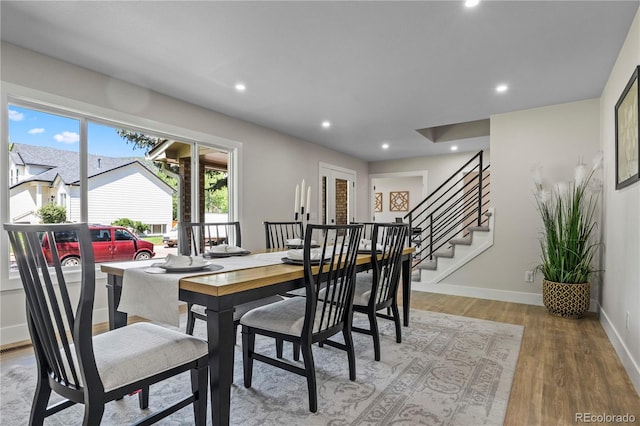 34 Honey Locust, Littleton, CO 80127 - dining room featuring light wood-style flooring, recessed lighting, and stairway