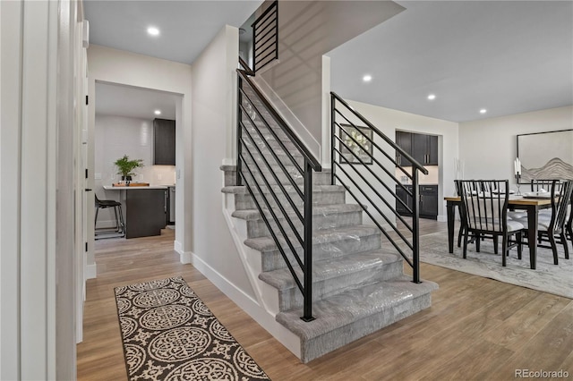 34 Honey Locust, Littleton, CO 80127 - stairs with wood finished floors and recessed lighting