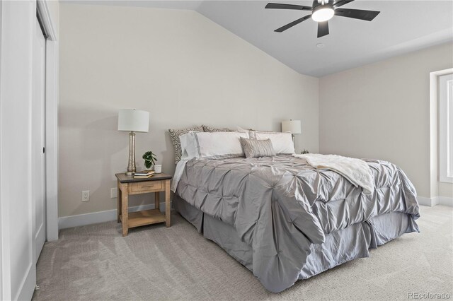 34 Honey Locust, Littleton, CO 80127 - bedroom with light colored carpet, vaulted ceiling, and a ceiling fan