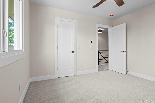 34 Honey Locust, Littleton, CO 80127 - unfurnished bedroom featuring carpet flooring and ceiling fan