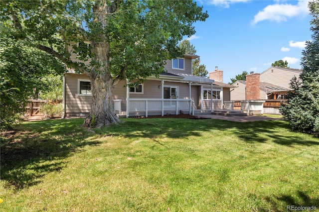 34 Honey Locust, Littleton, CO 80127 - back of property featuring a deck