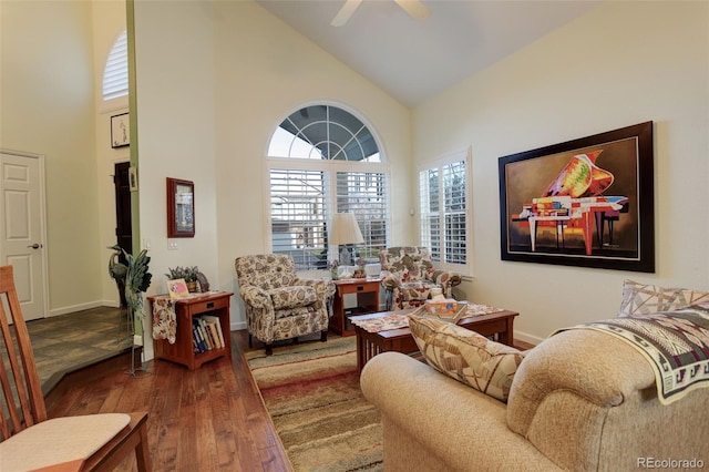 living room featuring hardwood / wood-style flooring, high vaulted ceiling, and ceiling fan