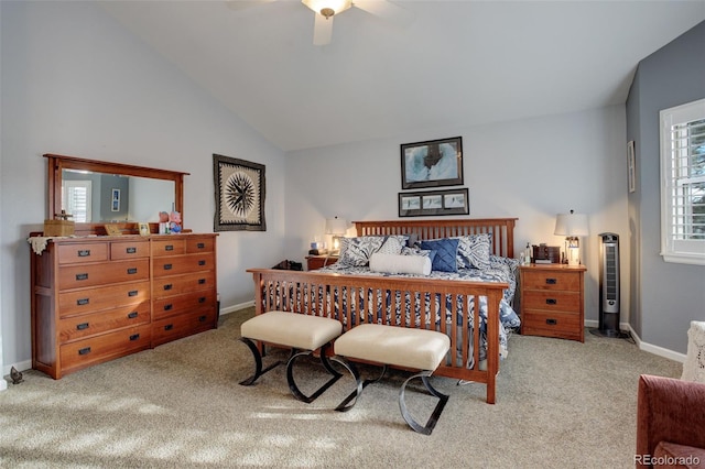 bedroom with ceiling fan, high vaulted ceiling, and light colored carpet