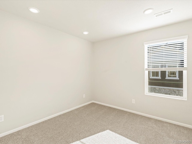 unfurnished room featuring carpet