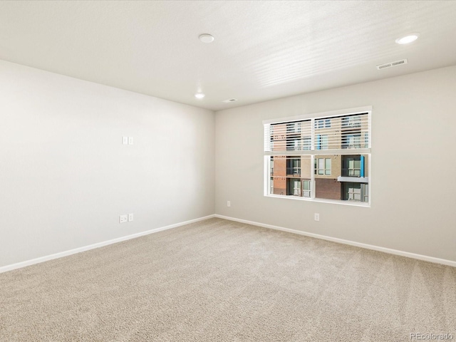 unfurnished room featuring carpet flooring