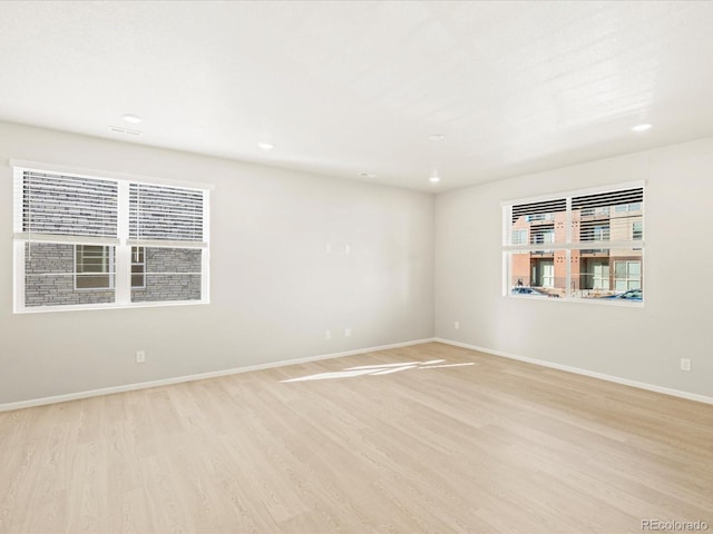 unfurnished room featuring light hardwood / wood-style flooring