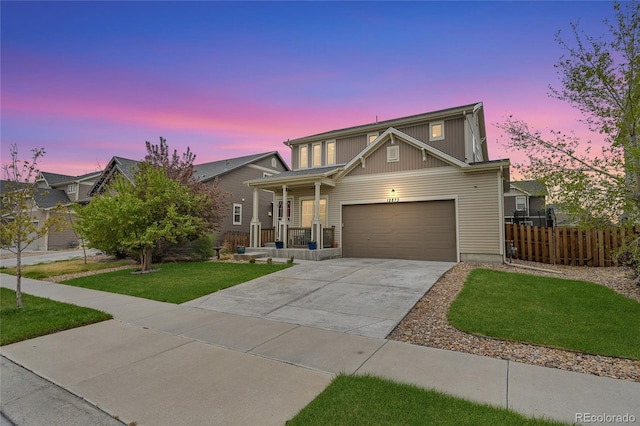 12873 E 108th Ave, Commerce City, CO 80022 - traditional-style home featuring fence, a garage, a front yard, concrete driveway, and covered porch